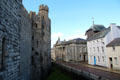 Buildings, including Old Courthouse, along Castle Ditch opposite Caernarfon Castle. Caernarfon, Wales.