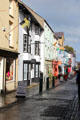 Shops & flags along Palace St. Caernarfon, Wales.