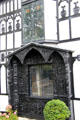Ornate carved window surround with bay window above on front facade of Plas Newydd. Llangollen, Wales.