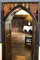 Gothic Revival arched carved wood doorway with stained glass insets at Plas Newydd. Llangollen, Wales.