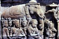 Carved stone relief of elephant & attendants at Borobudur. Indonesia.