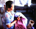 Woman waxes pattern for batik. Jogyakarta, Indonesia.