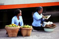 Food sellers await trains. Jogyakarta, Indonesia.