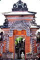 Carved gate leading to idol at a home temple. Bali, Indonesia.