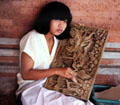 Artist finishing a wood carving. Bali, Indonesia.