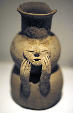 Qotakalli jug of face leaning on hands in Inca Museum, Cusco, found in Cusco region. Peru.