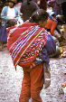 Woman with baby on back at market, Pisac. Peru.