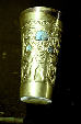 Lambayeque beaker in gold & turquoise with human figure in Lima's Gold Museum. Peru.