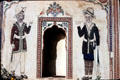 Painting on wall of haveli shows two Indians with antique rifles. Mandawa, India