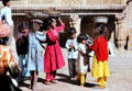 Children balancing bowls on their heads in Jaiselmer. India.