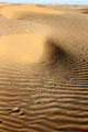 Footprints mark sand of Sam Sand Dunes. India.