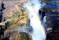 Large rainbow seen over Victoria Falls. Zimbabwe.