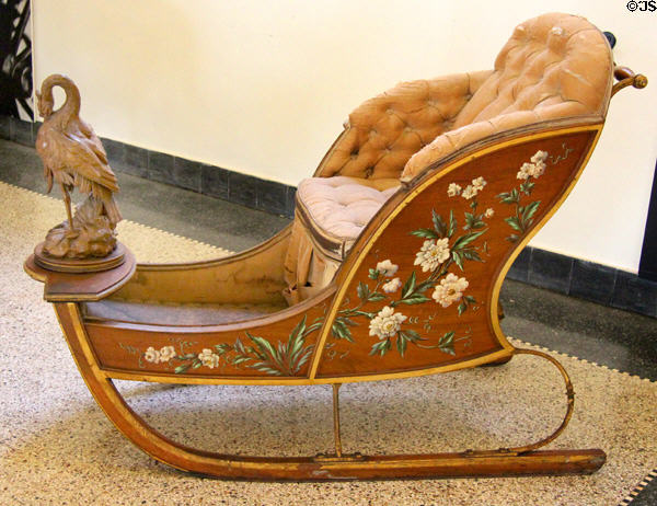 Push Sled, (c1900-1925) belonging to Queen Wilhelmina & which had to be pushed by hand; featuring a wooden carving of crane defeating a snake. Het Loo, Netherlands.