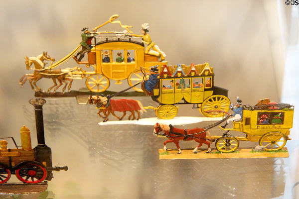Detailed tin figure models of stage coaches & an early steam train engine at National Tin Figure Museum. Ommen, Netherlands.
