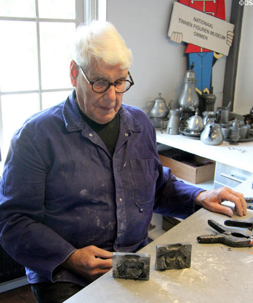 Artisan demonstrating the art of making tin figures at National Tin Figure Museum. Ommen, Netherlands.