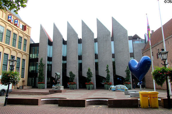 New Zwolle City Hall (1975) on Grote Kerkplein Square highlighted by the Rodin statue, entitled "Adam". Zwolle, Netherlands.