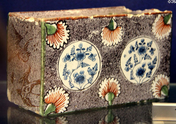 Ceramic medallions on flower brick (c1750-60) made in Bristol at Bristol Museum & Art Gallery. Bristol, England.