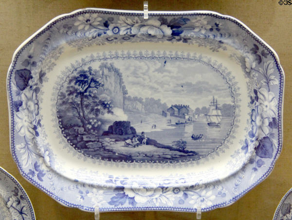 Blue & white oval serving dish (1825-35) showing Avon River scene made by Bristol Pottery using underglaze transfer printing process at Bristol Museum & Art Gallery. Bristol, England.