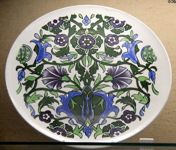 Underglaze-painted plate (last half of 1800's) with bold floral design on bright white background made by Bristol Pottery at Bristol Museum & Art Gallery. Bristol, England.