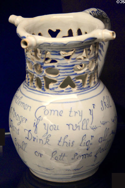Ceramic puzzle jug (1736) used for drinking games, probably made in Liverpool, at Bristol Museum & Art Gallery. Bristol, England.