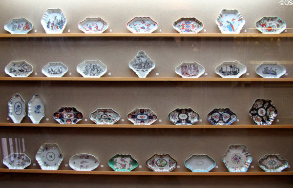 Collection of Worcester ceramic spoon trays & teapot stands (c1755-c1780), both a customary part of a dinner service to protect highly polished table top from drips & spills, made by Worcester factory, at Bristol Museum & Art Gallery. Bristol, England.