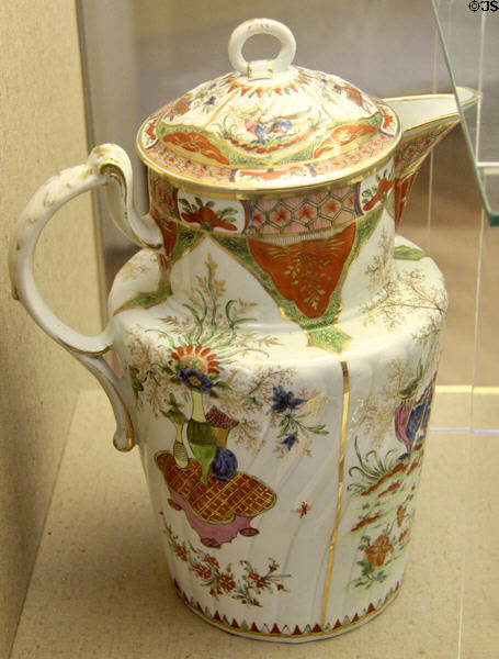 Ceramic jug & cover (c1790) overglaze-painted & gilded, with a crest & monogram P.O.B, may have held hot mulled wine, cider or beer, made in Worcester, at Bristol Museum & Art Gallery. Bristol, England.