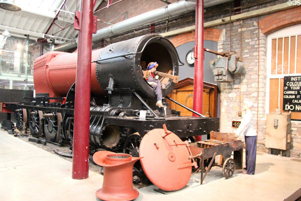 Female boilersmith working on engine at STEAM Museum of Great Western Railway. Swindon, England.