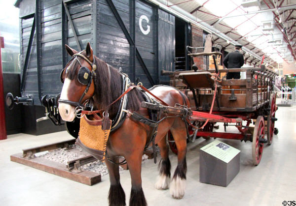 Model of horse dray being used to deliver goods to freight car at STEAM Museum of Great Western Railway. Swindon, England.