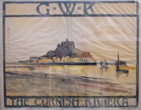 GWR poster advertising "The Cornish Riviera" with image of St Michael's Mount island & castle at STEAM Museum of Great Western Railway. Swindon, England.