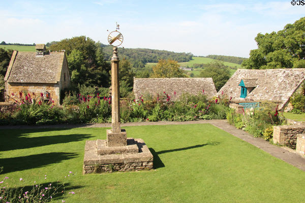 Sundial on pedestal standing in garden at Snowshill Manor. England.
