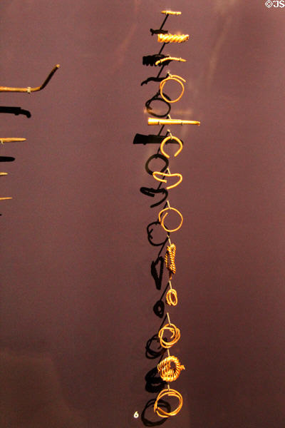 Torc (twisted metal bands) fragments & twisted rods at Corinium Museum. Cirencester, England.