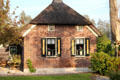 Side view of thatched roof home. Giethoorn, Netherlands.