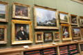 Art gallery with paintings hung above pull-out display drawers at Teylers Museum. Haarlem, Netherlands.