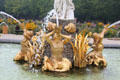 Gilded merman statues on Venus Fountain with triton figures blowing conch shells to calm the seas. Het Loo, Netherlands.