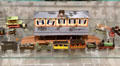Tin figure old fashioned railroad station with steam engine and rail carriages at National Tin Figure Museum. Ommen, Netherlands.