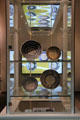 Stoneware dishes with Dutch script in the center at ANNO Stadsmuseum Zwolle. Zwolle, Netherlands.