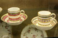 Porcelain coffee cups & saucers overglaze painted & gilded in the new-classical taste, made by Richard Champion at Bristol Porcelain at Bristol Museum & Art Gallery. Bristol, England.