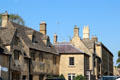 Row of Cotswold stone buildings with slate roofs on High St. Chipping Campden, England.